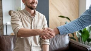 Agreement signing between landlord and host, highlighting essential Airbnb hosting tips for successful property management.
