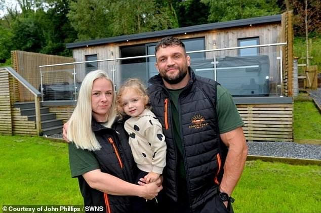 John Phillips, pictured here with his wife Kerrie Garrett and daughter Darcy, has vowed to fight the council's decision to demolish his AirBnBs